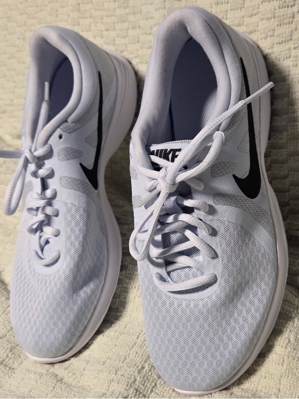 Nike Women’s White Athletic Sneakers with Black Swoosh